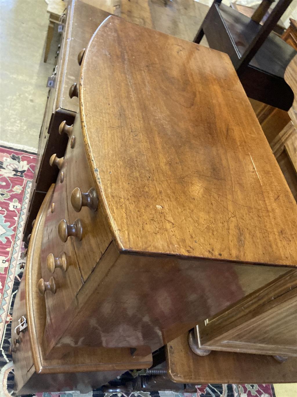 A near pair of Victorian mahogany bowfront commodes, larger 66cm, depth 40cm, height 68cm